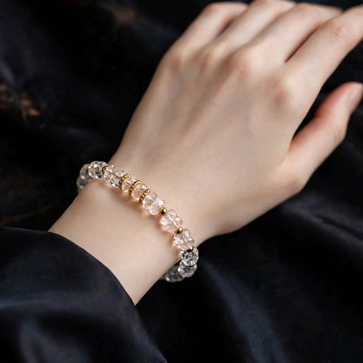 Clear crystal bracelet worn on a wrist