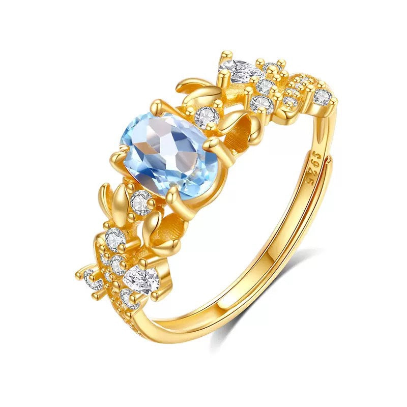 Bauhinia ring with topaz stone on white background
