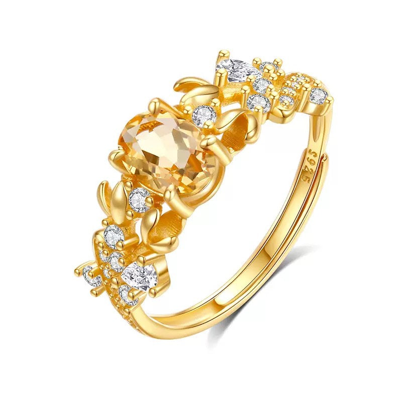 Bauhinia ring with citrine stone on white background