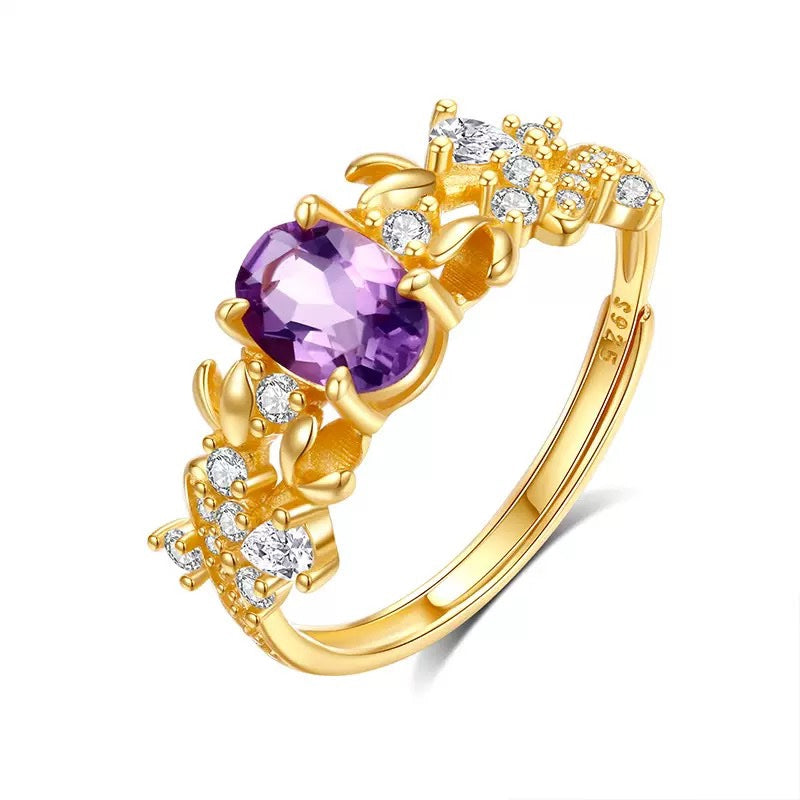 Bauhinia ring with amethyst stone on white background